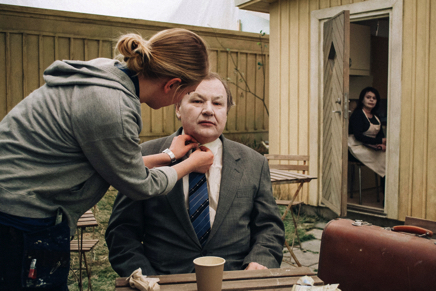 Julia Tegström preparing Holger Andersson for a take